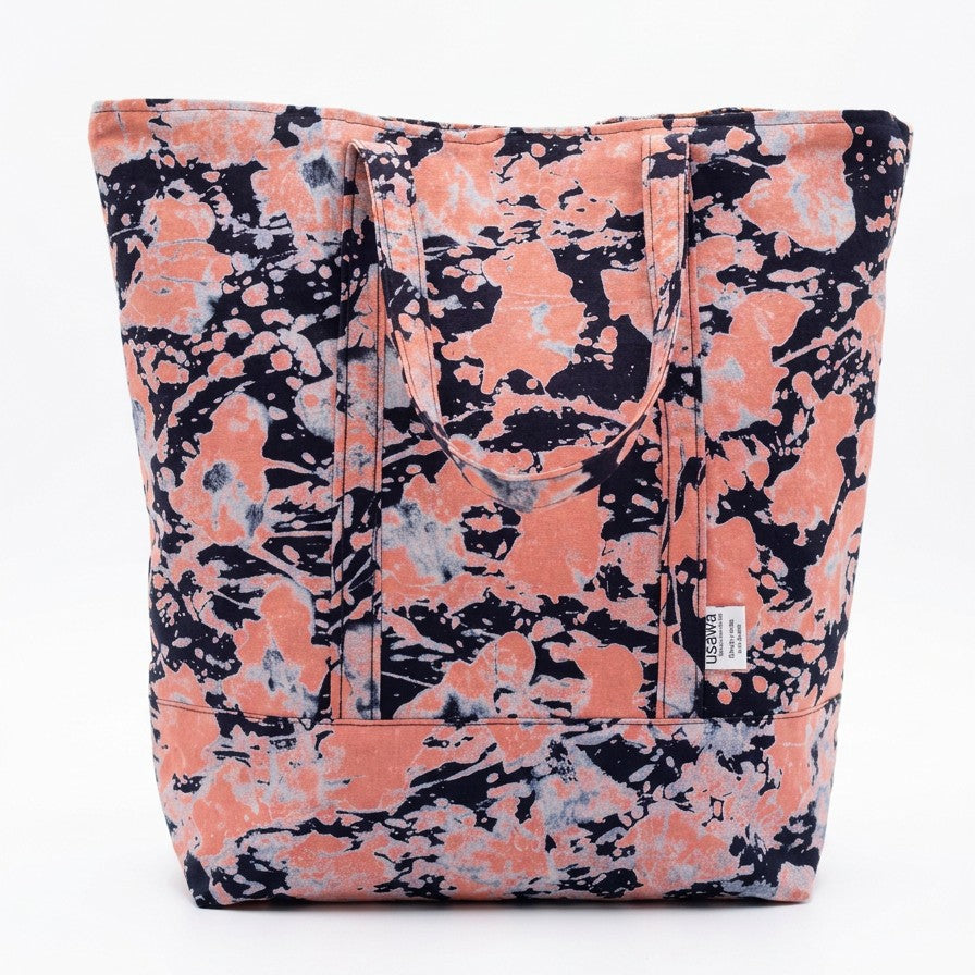Vista de frente del bolso tote nil de batik color rosa