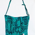 Detalle del asa del bolso tote nil de batik color turquesa